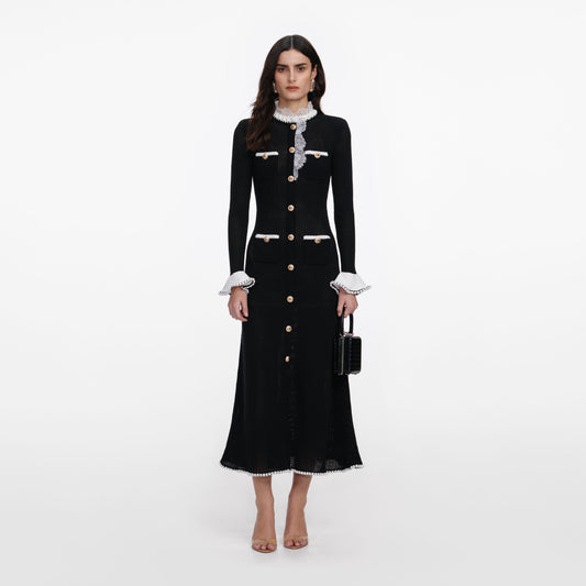 Front view of a woman wearing the Black Lace Trim Knit Midi Dress
